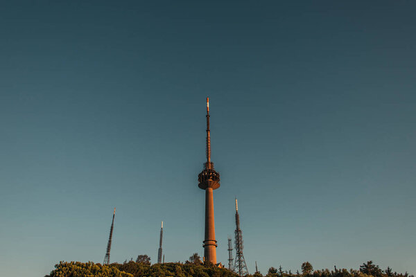 tv and radio towers against cloudless sky 