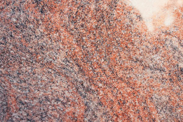 Textured surface of multicolored granite stone, top view — Stock Photo