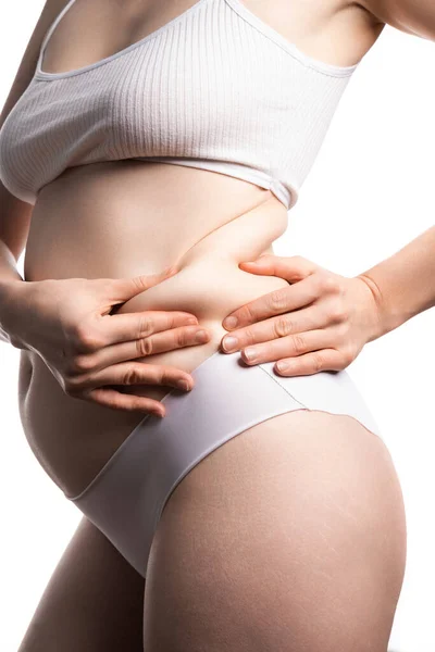 Femme au ventre gras, corps féminin en surpoids isolé sur fond blanc, plan studio — Photo