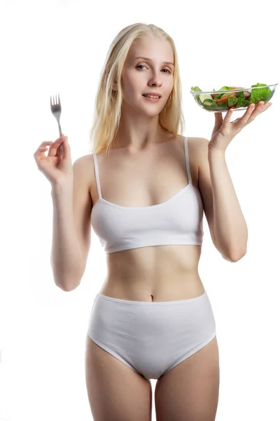 Beautiful young woman with salad, isolated on white — Stock Photo, Image