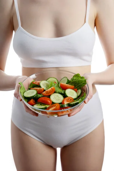 Beautiful young woman with salad, isolated on white — Stock Photo, Image