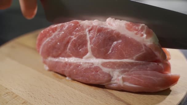 Raw beef steak cut on a wooden board, slow motion — Stock Video