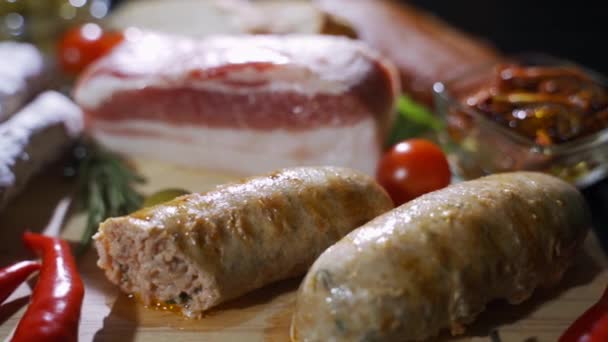 Assorted meats and sausages, olives and spices, close-up, horizontal — Stock Video