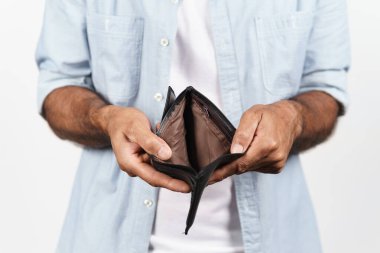 Close up of man hands holding and empty wallet on white background. financial crisis, bankruptcy, no money, bad economy Concept.