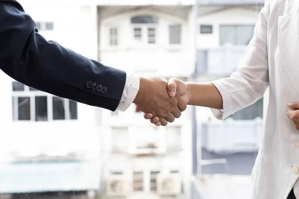 Greeting and meeting, business partners as partners shaking hands to congratulate each other to work together, Building friendship in real estate investment , handshake concept.