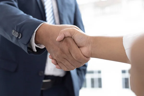 Greeting and meeting, business partners as partners shaking hands to congratulate each other to work together, Building friendship in real estate investment , handshake concept.