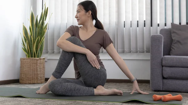 Slim fit Asian woman  Internet coach yoga and meditation coaching videos make them feel relaxed, female happiness, Stretching the muscles of the body and practicing proper breathing, Exercise concept.
