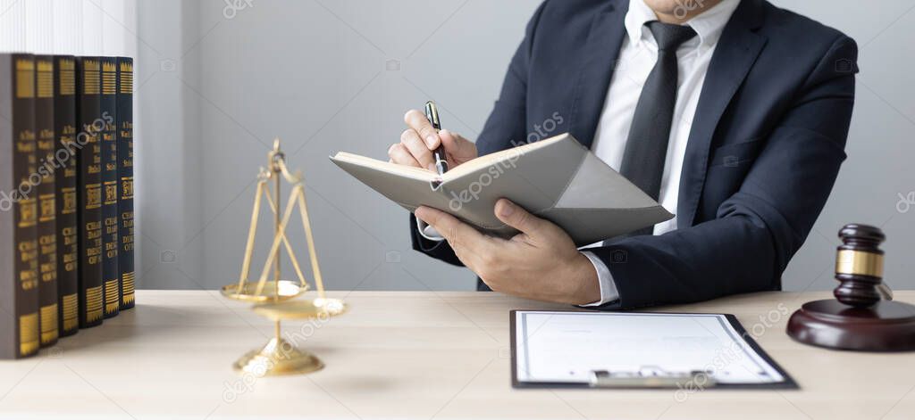 Lawyers or judges sign documents in accordance with legal and fair terms of agreement, Legal Ethics and Integrity, scales of justice, law hammer, Litigation and legal services.
