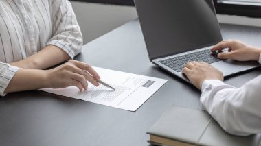 Job application, Employer or HR examines the applicant's information with a laptop to check their work history and ability to perform, Manager resource employment and recruitment.