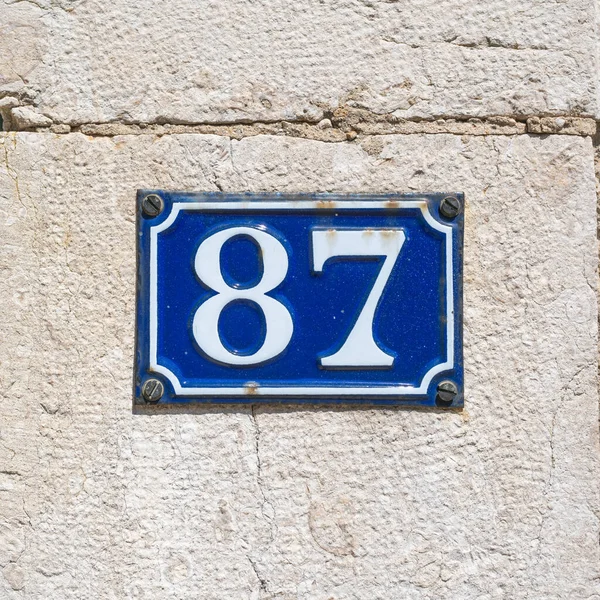 Enameled House Number Eighty Seven Stone Wall — Stock Photo, Image