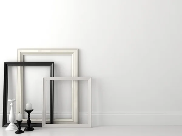 Molduras clássicas preto e branco na parede branca — Fotografia de Stock