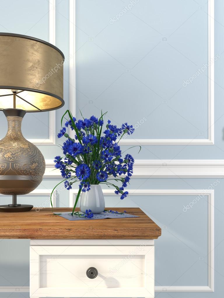 Vintage table and table lamp on a background of blue wall