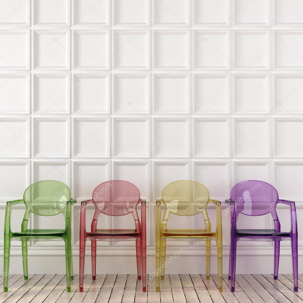 Colored transparent chairs and white wall