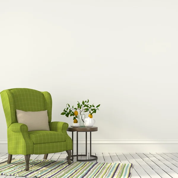 Green chair with a table in white interior — Stock Photo, Image