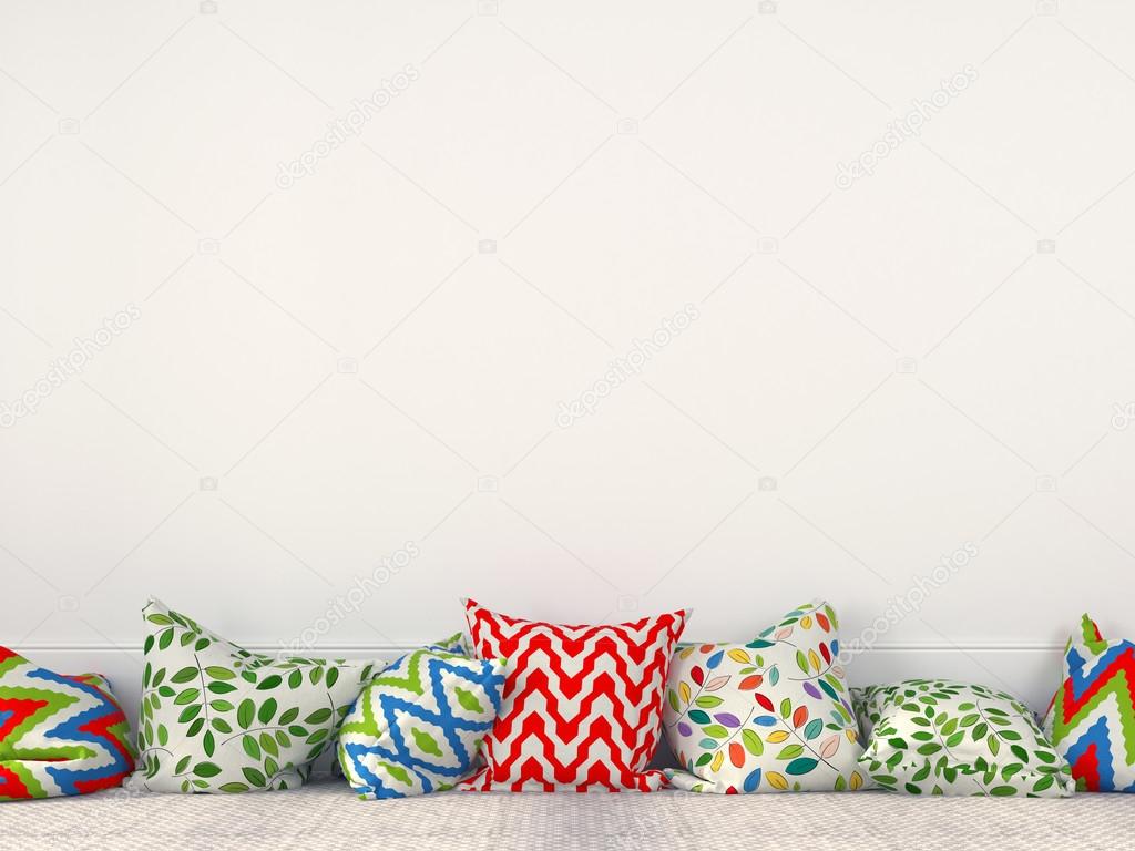 Colorful cushions near a white wall