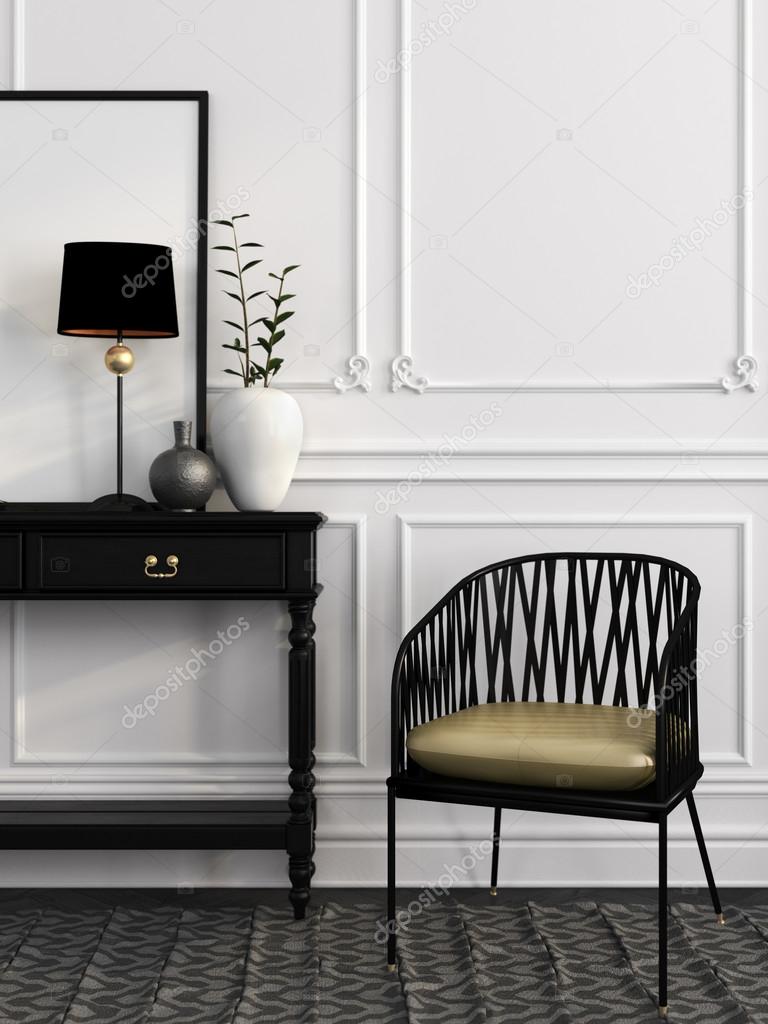 Black chair and table against a white wall