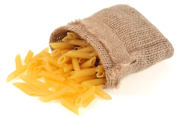 Canvas Bag Raw Penne Pasta Close White Background — Stock Photo, Image