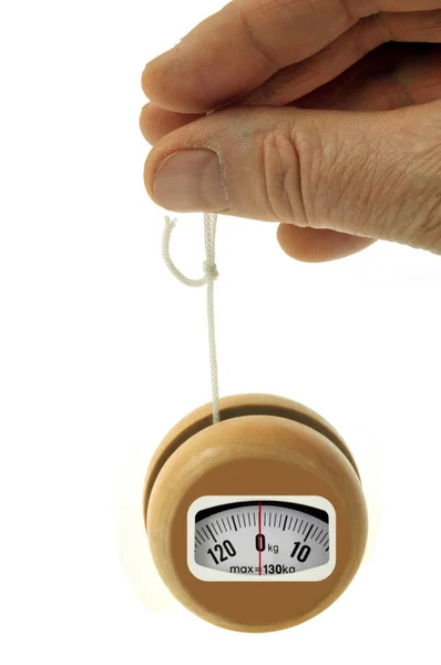 Concept Yoyo Bathroom Scale Held Hand Close White Background — Stock Photo, Image