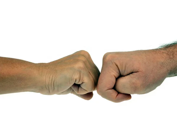 白い背景に2人の拳の密接な接触 — ストック写真