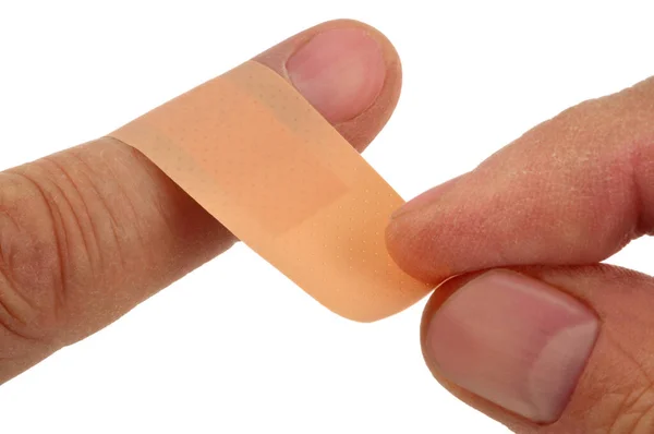 Colocar Uma Bandagem Dedo Close Fundo Branco — Fotografia de Stock