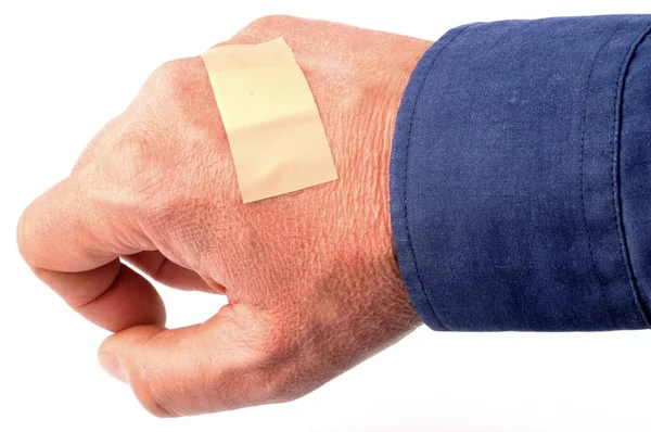 Hand Med Ett Bandage Närbild Vit Bakgrund — Stockfoto