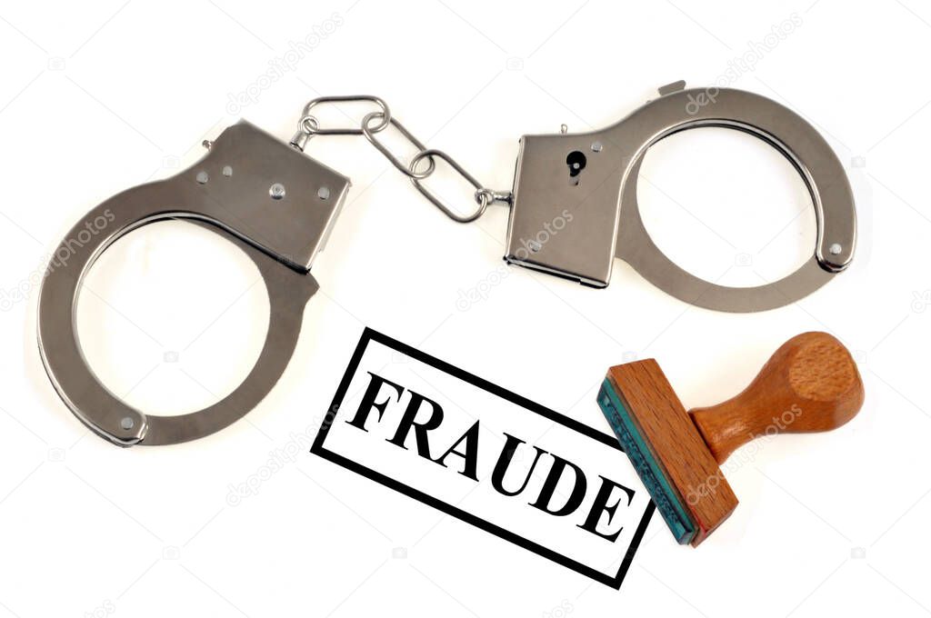 French fraud concept with ink pad and handcuffs on white background