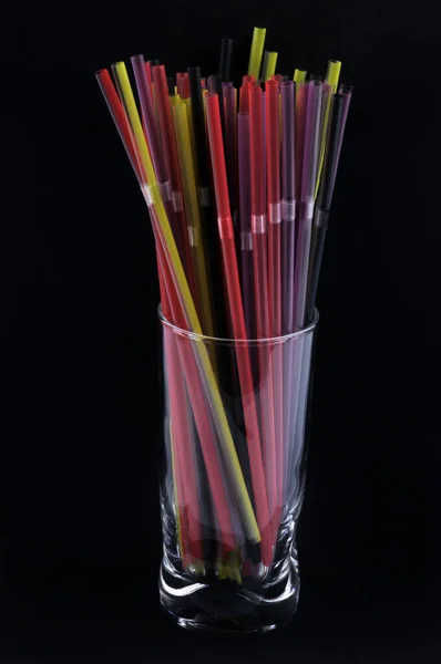 Plastic Straws Different Colors Glass Close Black Background —  Fotos de Stock