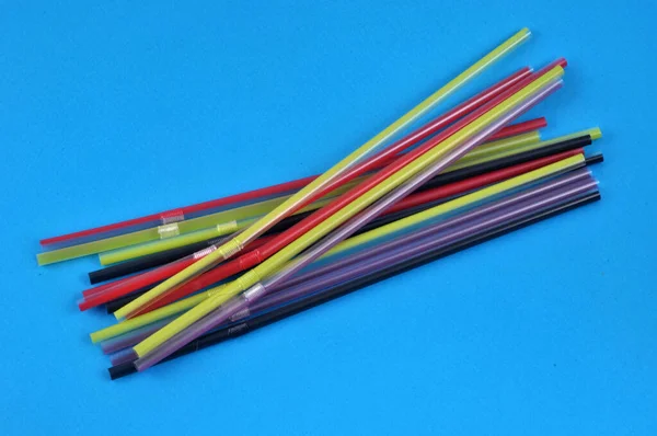 Plastic Straws Different Colors Close Blue Background —  Fotos de Stock
