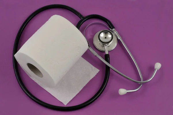 Constipation Concept Toilet Paper Roll Stethoscope Pink Background — Stock Photo, Image