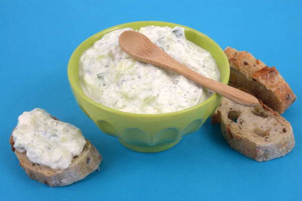 Bowl Tzatziki Wooden Spoon Slices Bread Close Blue Background — Stock Photo, Image