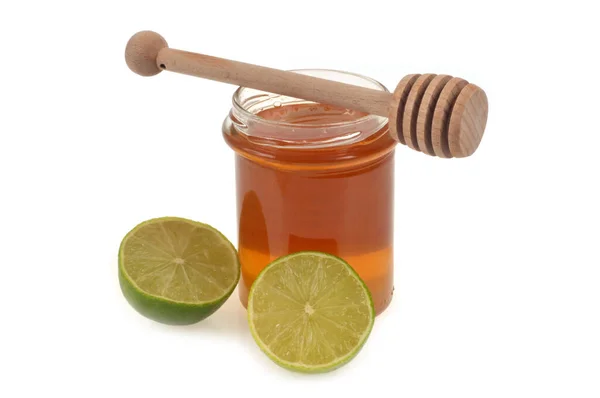 Jar Liquid Honey Honey Spoon Next Lime Cut Half Close — Zdjęcie stockowe