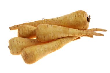 Close-up of raw parsnips isolated on a white background