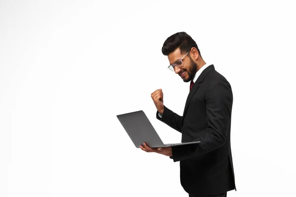 Portrait Young Indian Manager Using His Laptop Celebrating Victory White Imagen De Stock