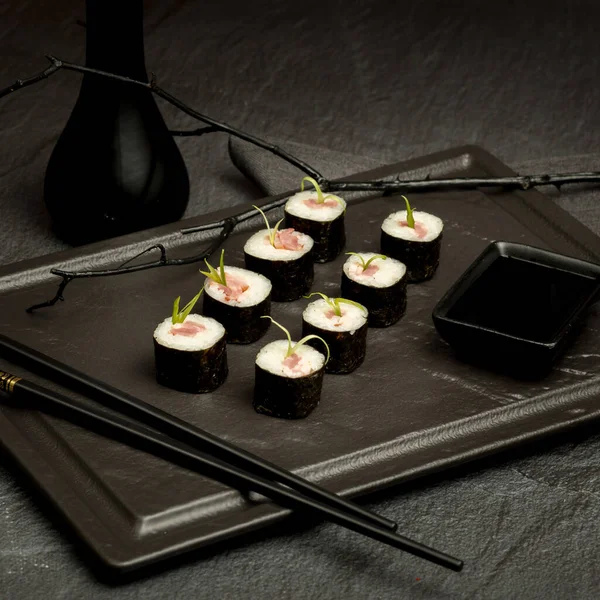 Appetizing sushi on a dark background