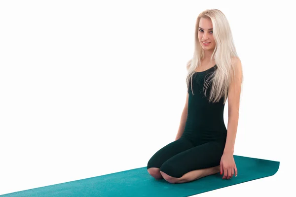 Woman practicing yoga — Stock Photo, Image