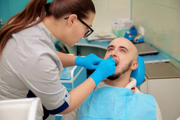 Picture of beautiful male model on cheking teeth in dental offic — Zdjęcie stockowe