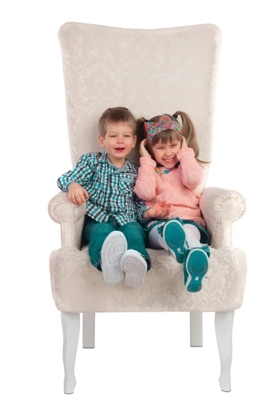 Children sit in a chair — Stock Photo, Image