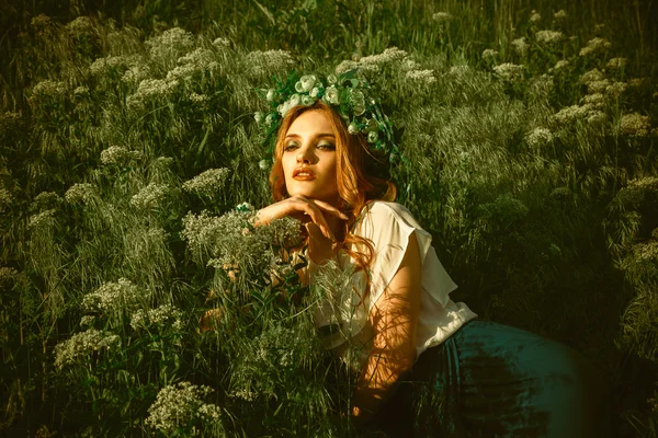 Beautiful young woman with wreath on head — Stock Photo, Image