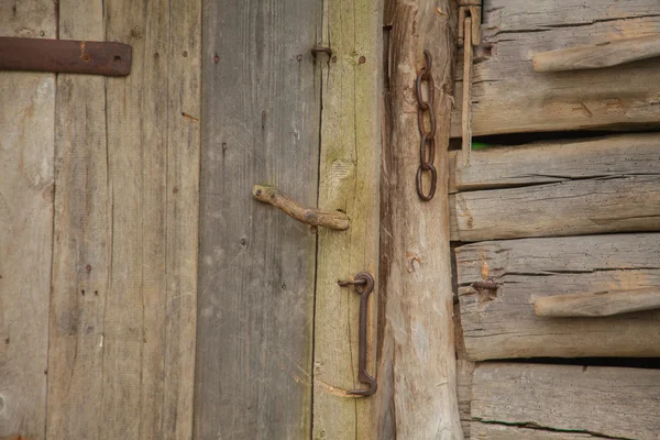 Old wooden door with a lock — Stock Photo, Image