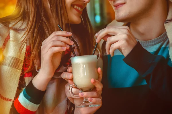 Couple on a date drinking one cup of cappuccino — Stock Photo, Image