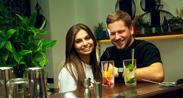 cheerful couple at the bar