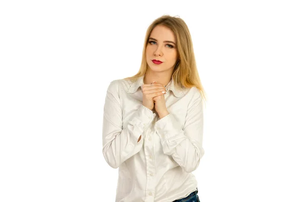 Girl in a white shirt squeezes hands — Stock Photo, Image