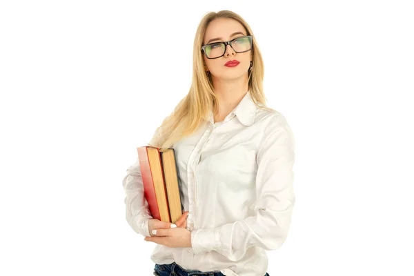 Blondine posiert mit Büchern im Studio — Stockfoto