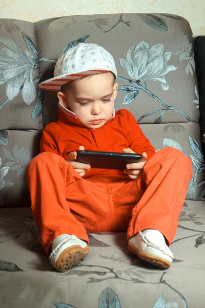 Young boy in red suit — Stock Photo, Image