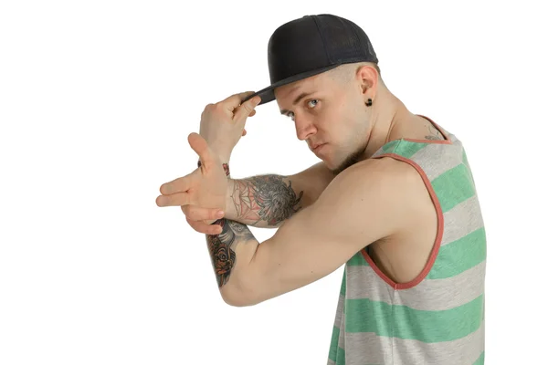 Man in casual clothes with cap looking at the camera — Stock Photo, Image