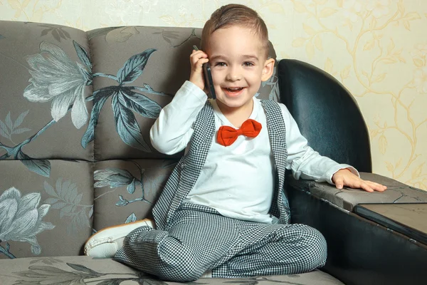 Happy young boy smiling and talking phone — Stock Photo, Image