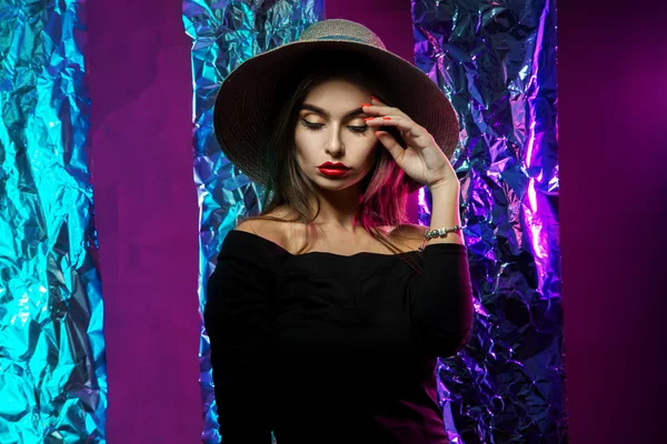 Sensual young girl in hat with wide brim — Stock Photo, Image