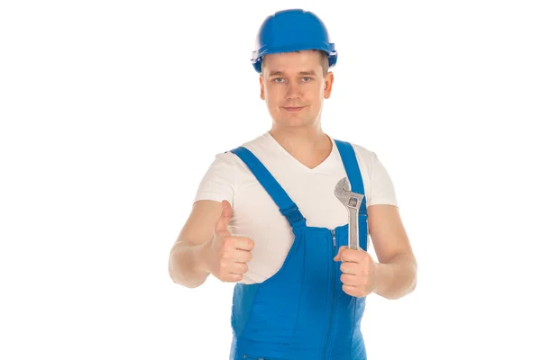 Мужчина-строитель с инструментами в руках — стоковое фото