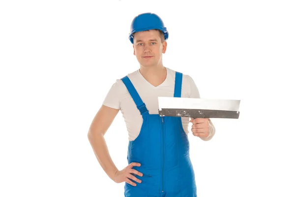 Builder i blå uniform med spackelspade — Stockfoto