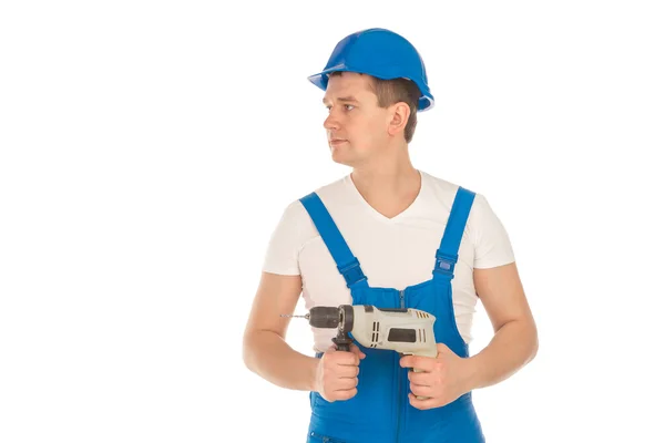 Young builder looking away in blue uniform — Stock Photo, Image